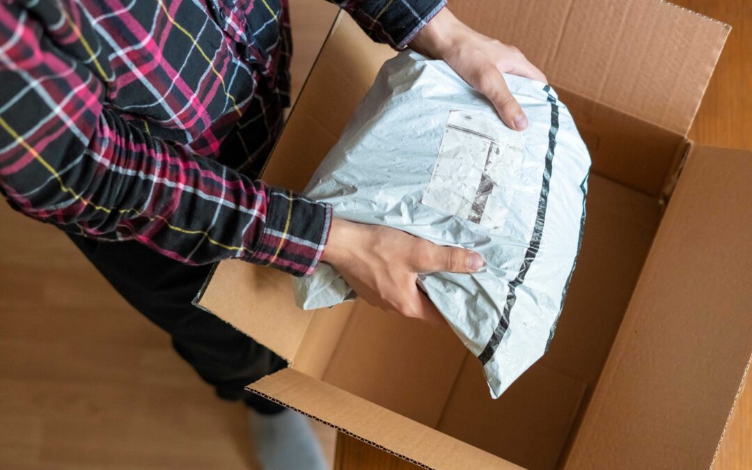 A man unpacking a home delivery box.